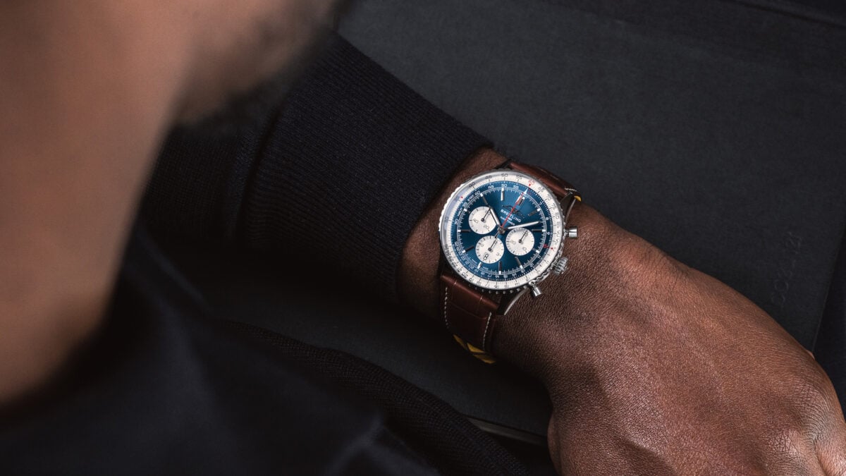 Wearing luxury Breitling Navitimer with stylish design.