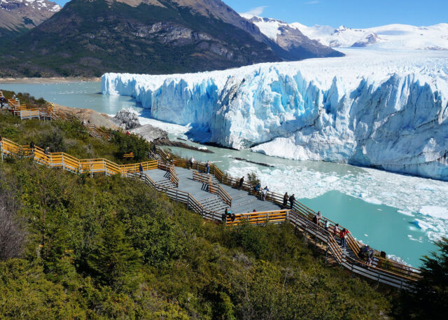 A glacier meets turquoise lake; stunning views.