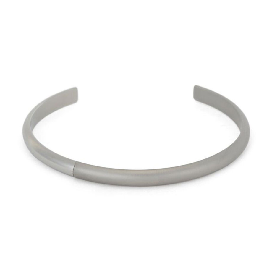 Men's polished silver cuff bracelet on display.