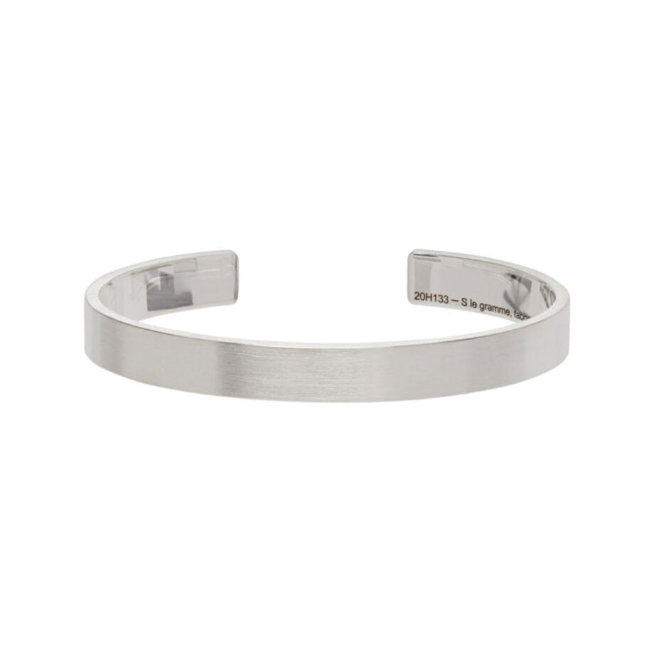 Timeless silver cuff bracelet with subtle engraving.