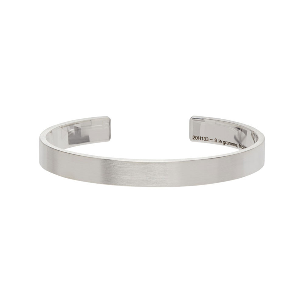 Timeless silver cuff bracelet with subtle engraving.
