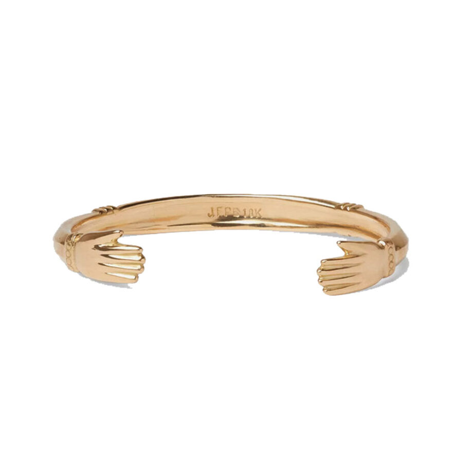 Gold bracelet with engraved brand, timeless elegance.