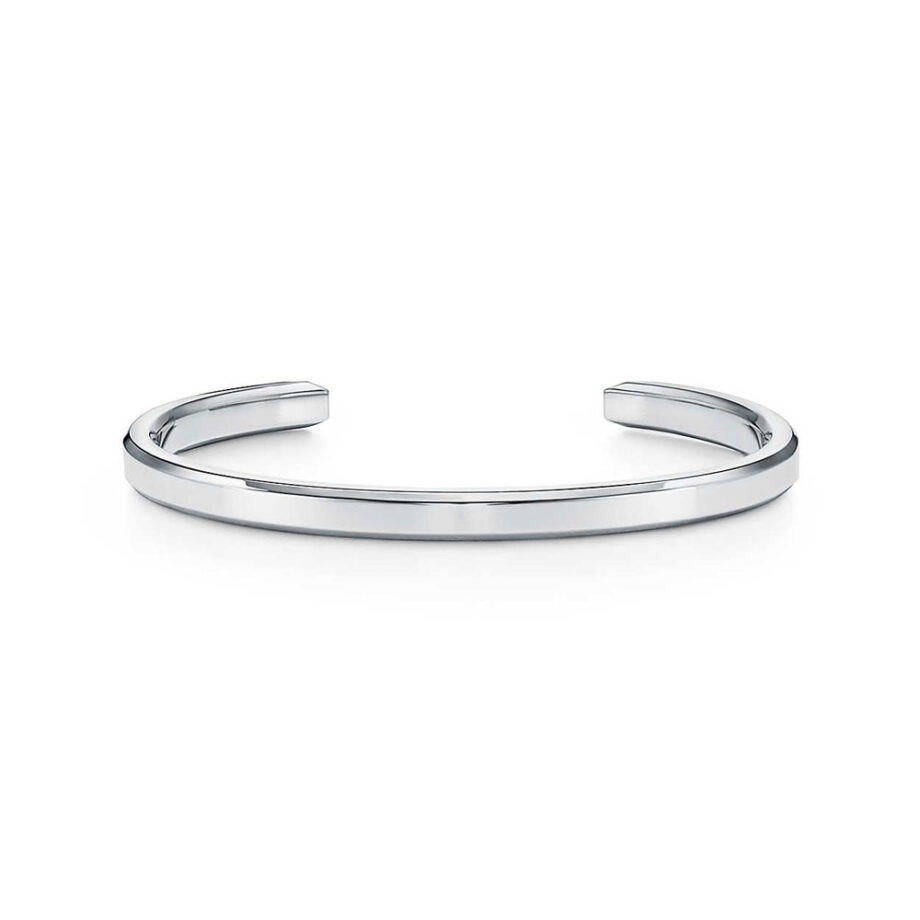 Minimalist silver cuff bracelet for men displayed.