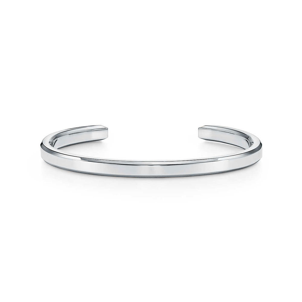 Minimalist silver cuff bracelet for men displayed.