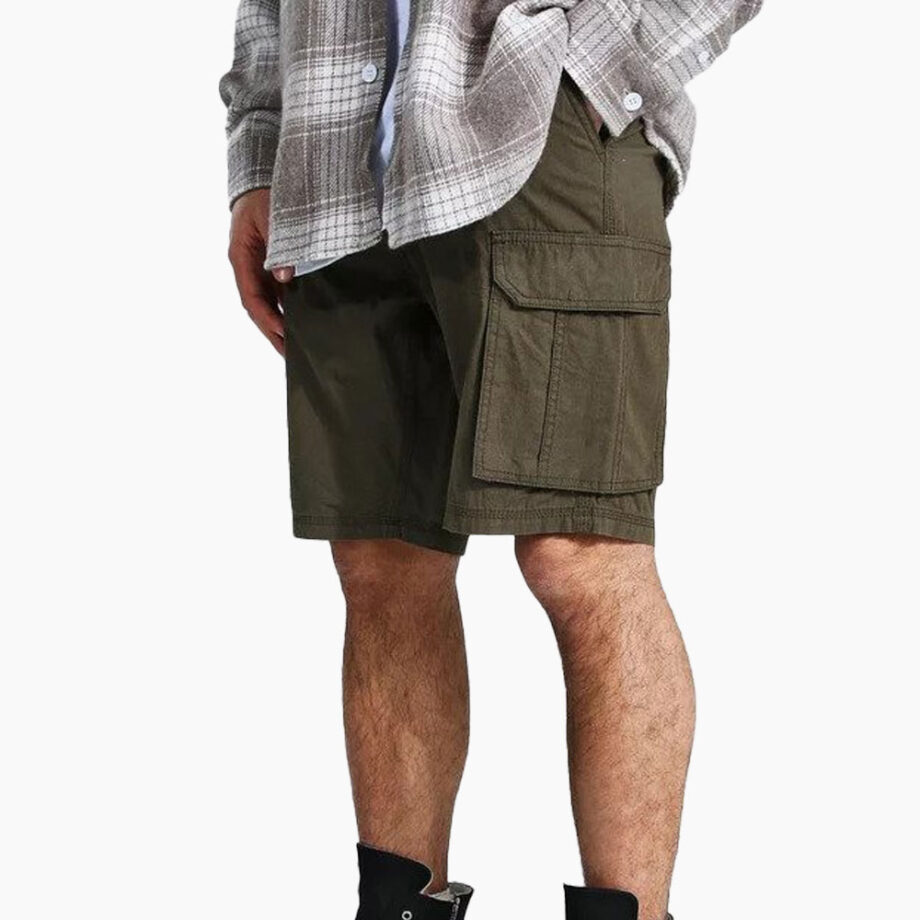 Person wears cargo shorts and plaid shirt.
