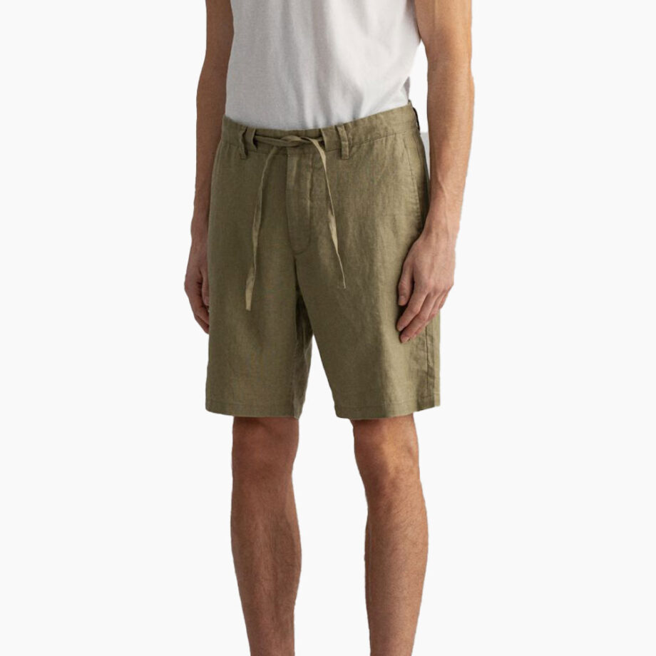 Man wearing cargo shorts and white tee.
