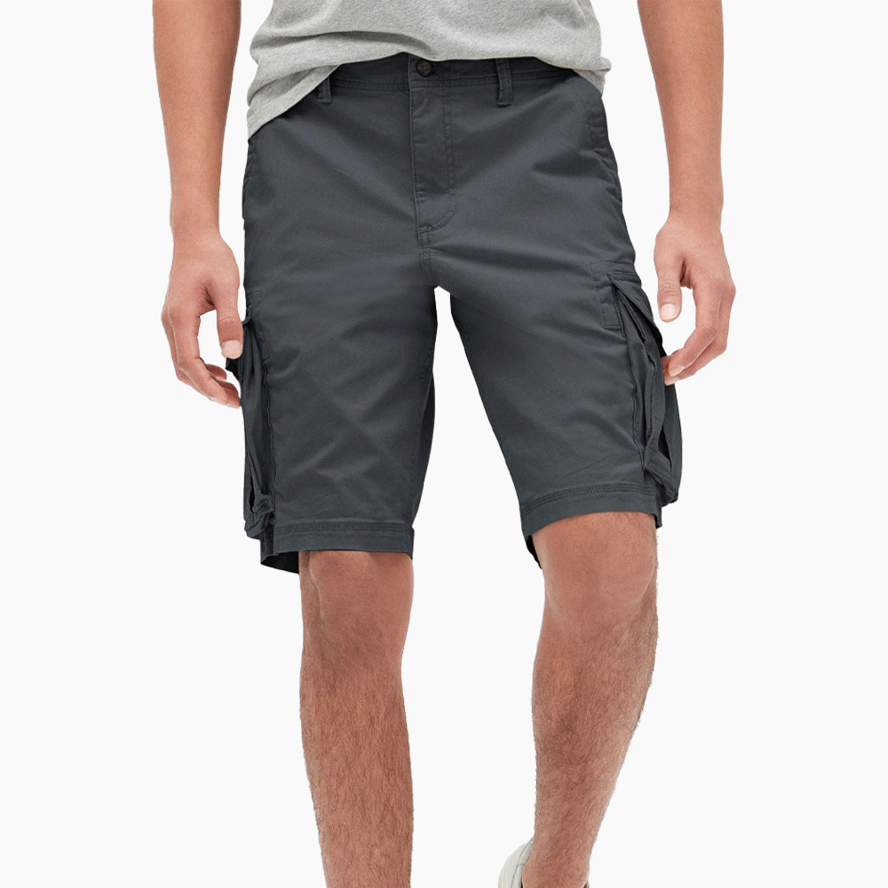 Person in gray tee and cargo shorts.