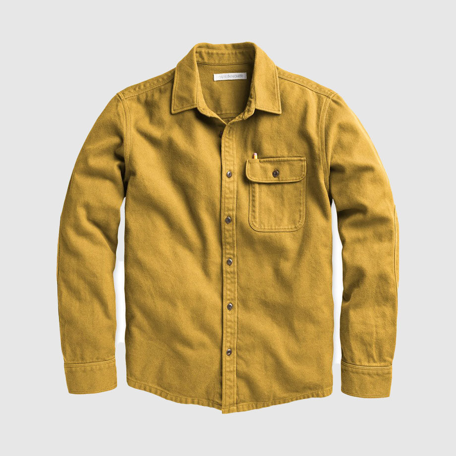 Mustard yellow button-up shirt with chest pocket.
