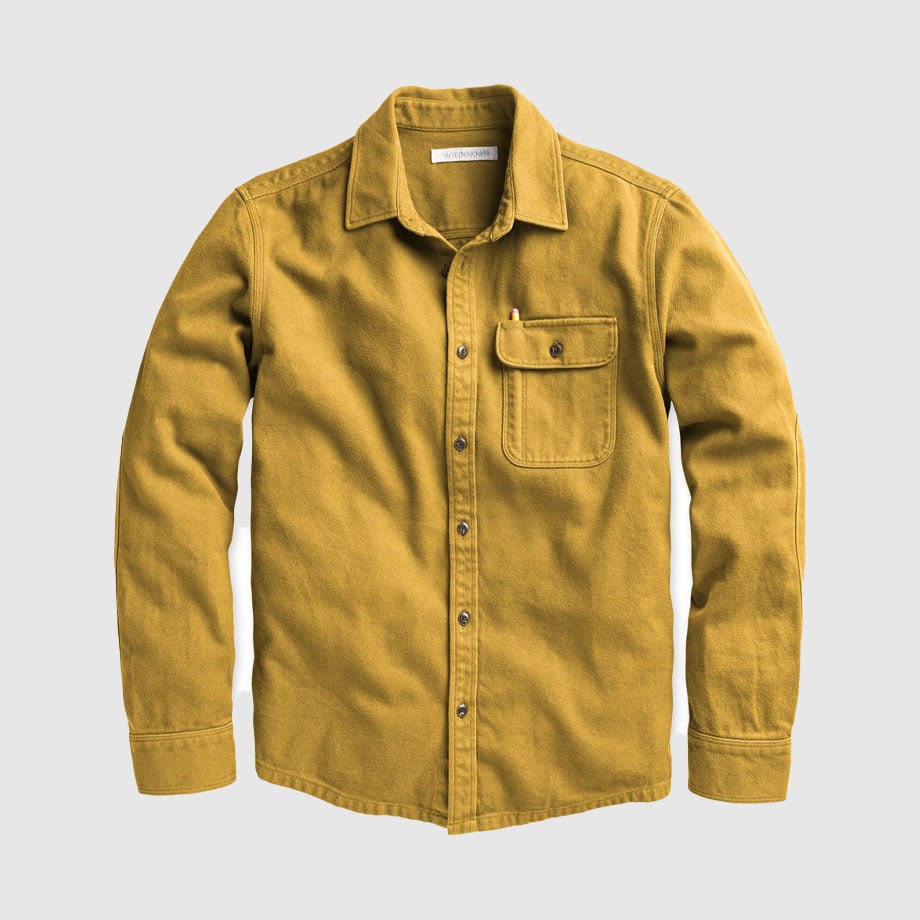 Mustard yellow button-up shirt with chest pocket.