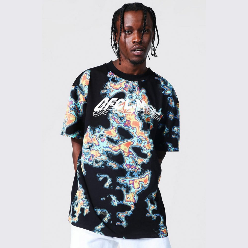 Man shines in a bold, stylish outfit.