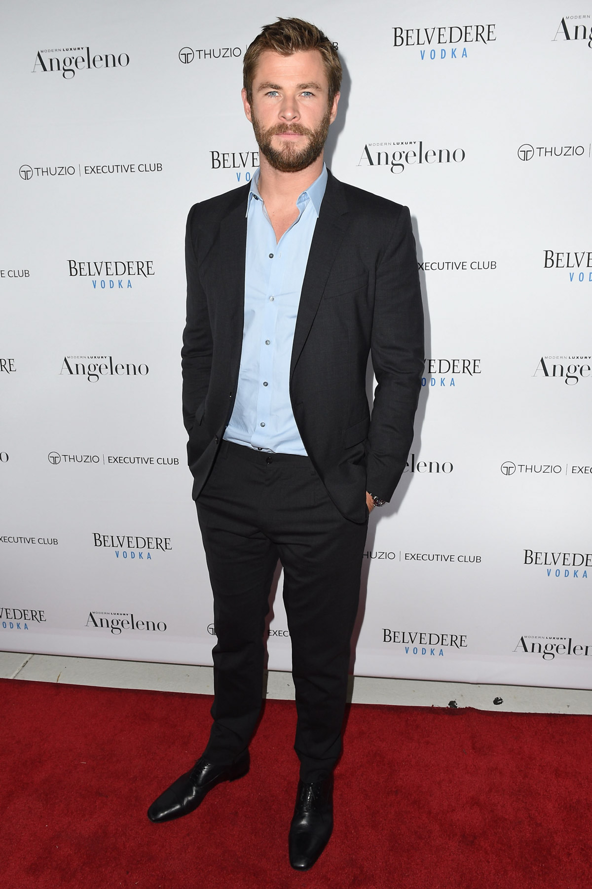 Chris Hemsworth-inspired, black tux, posing.