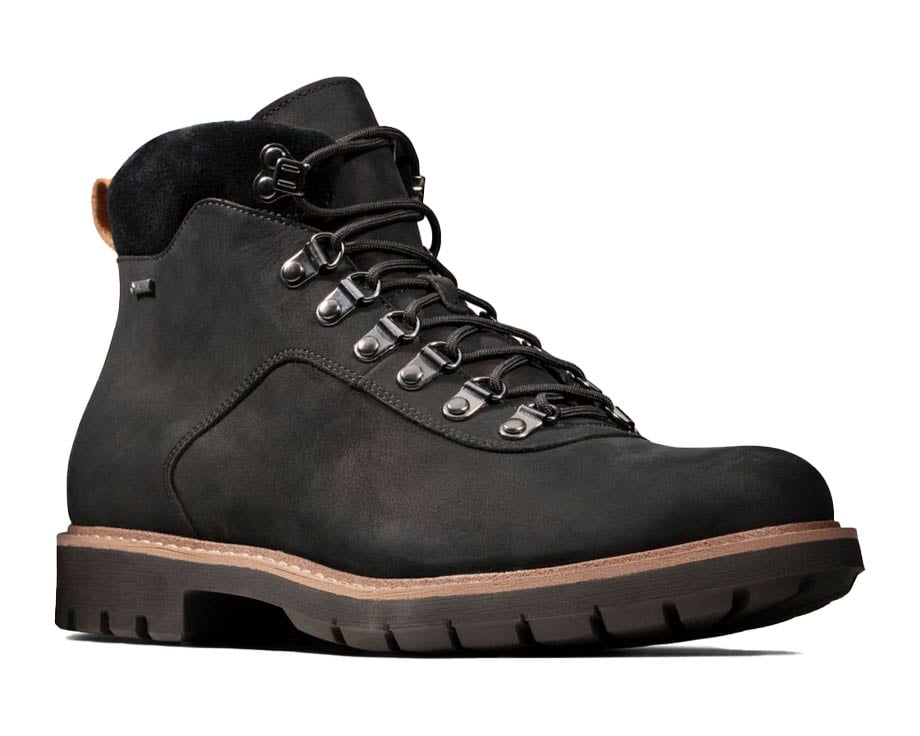 Dark green hiking boot with black sole.