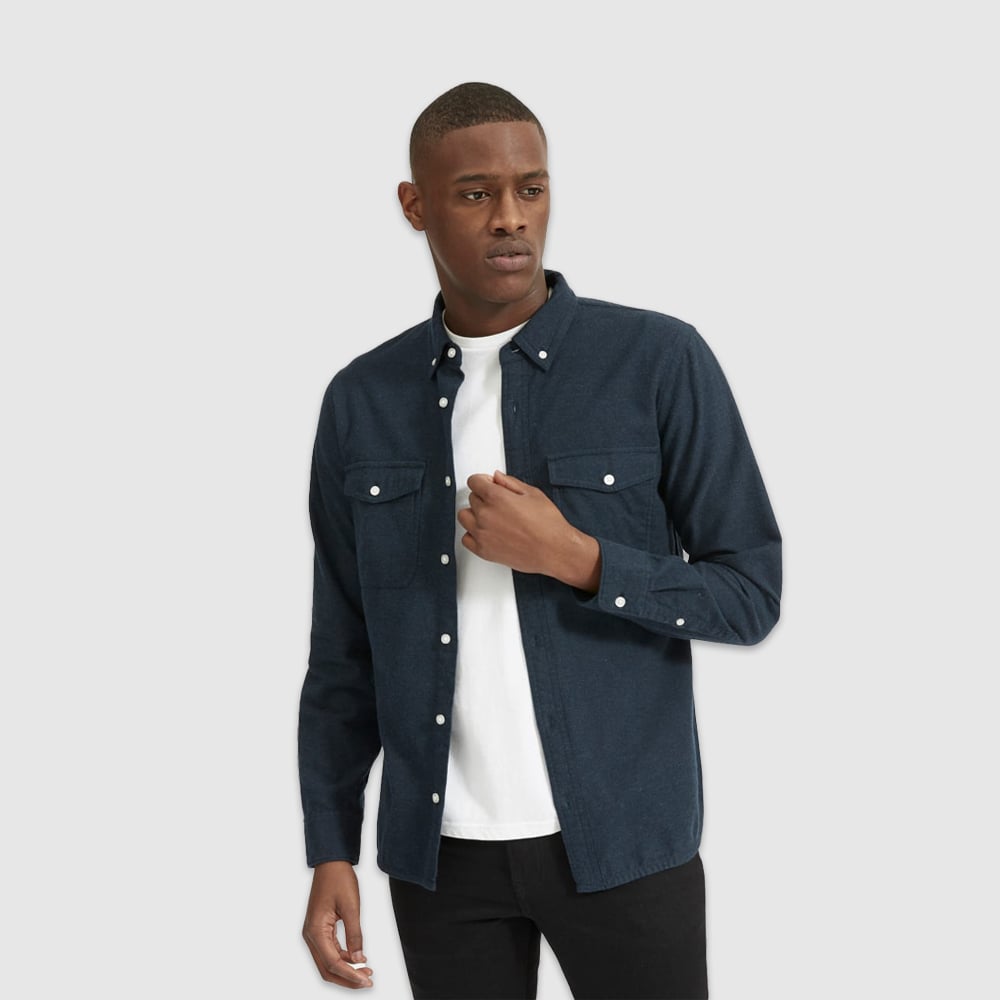 Man in stylish shirt posing.