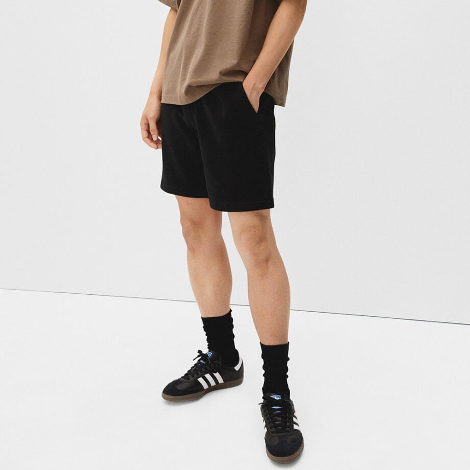 Person in casual wear with relaxed confidence.