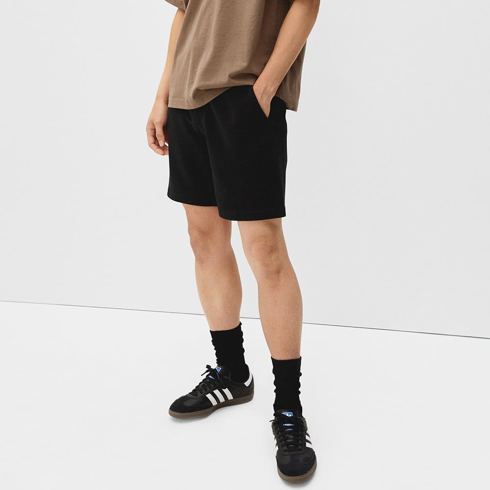 Person in casual wear with relaxed confidence.