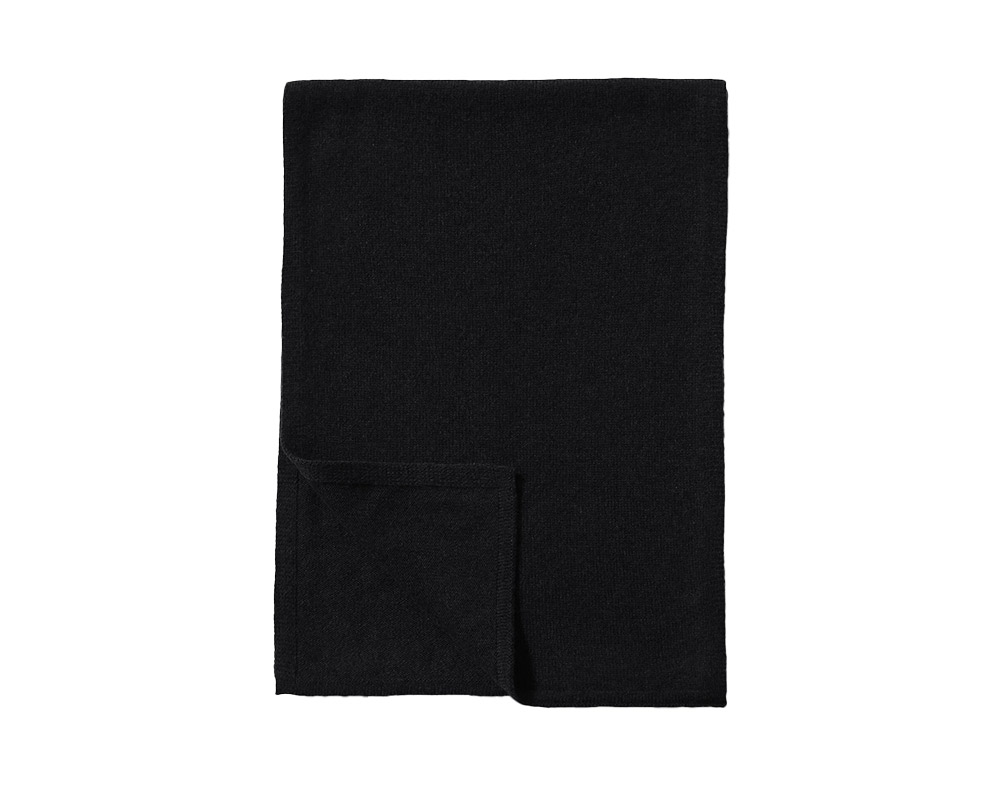 Black men's scarf on white backdrop, wintery warmth.