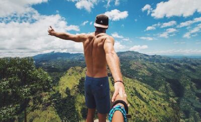 Mountaintop embrace amid scenic beauty.