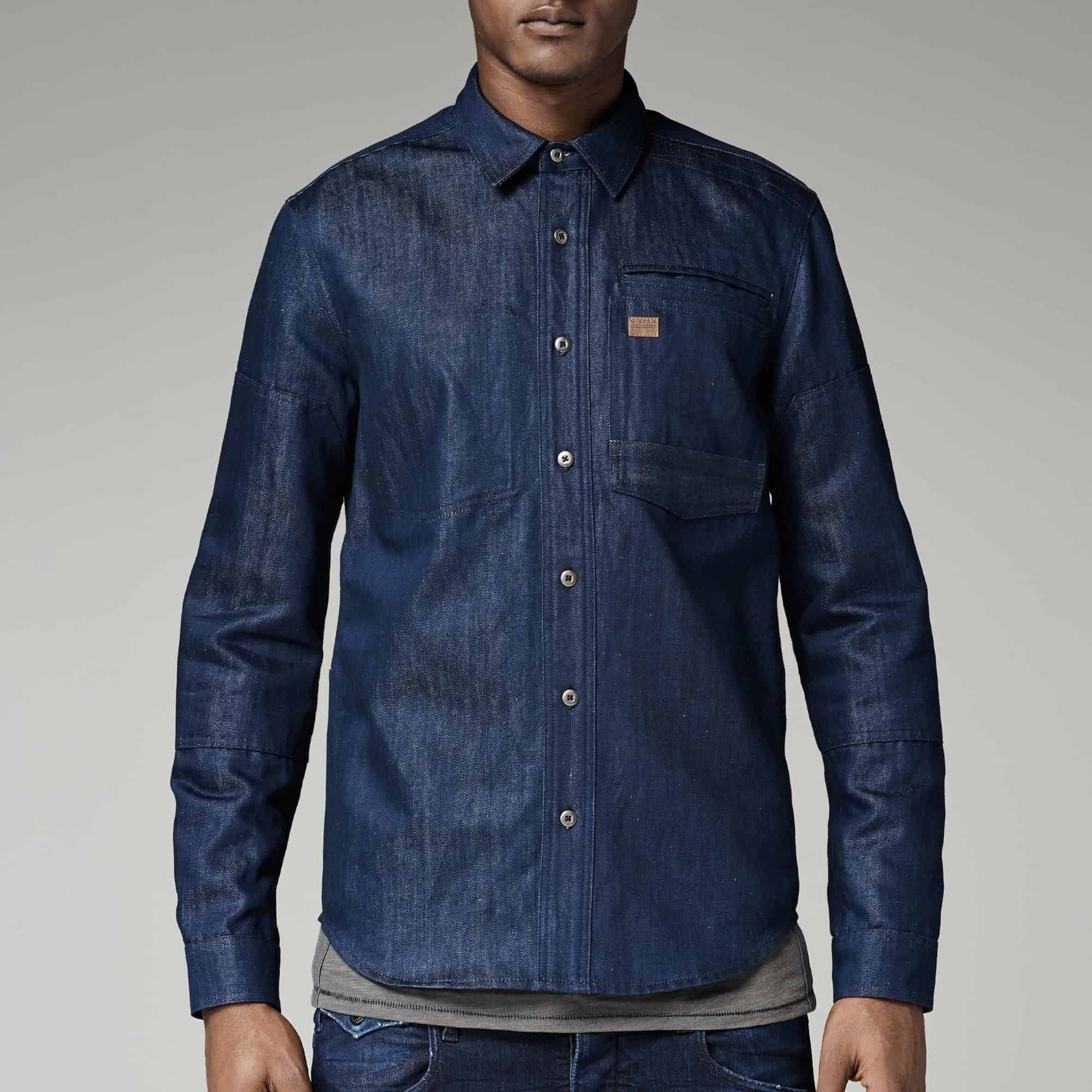 A man models denim outfit.