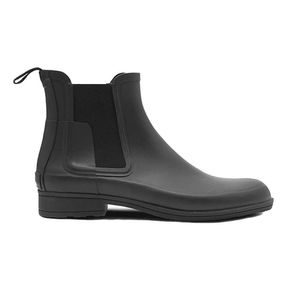Black rubber Chelsea boot with elastic panels.