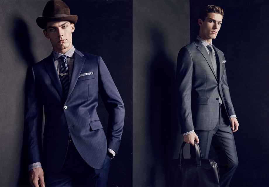 Two men in suits, modern dandies; navy and gray.