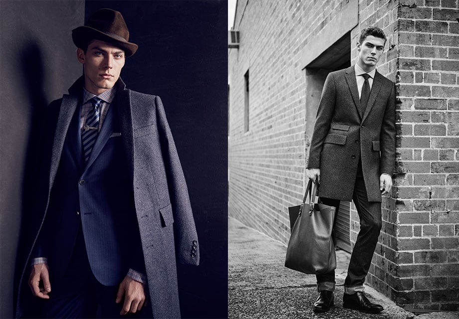 Man in dark suit, overcoat; poses formally, grayscale setting.