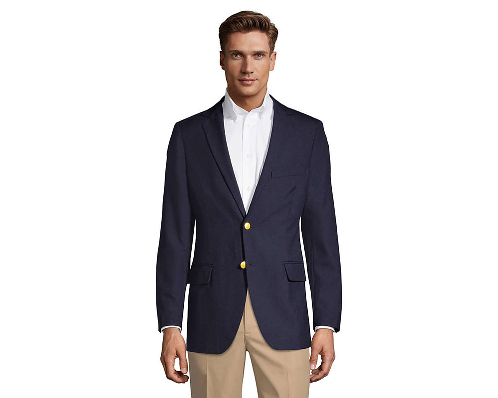 Man in navy blazer, white shirt, beige pants.