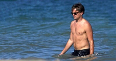 Man in ocean embodies fitness.