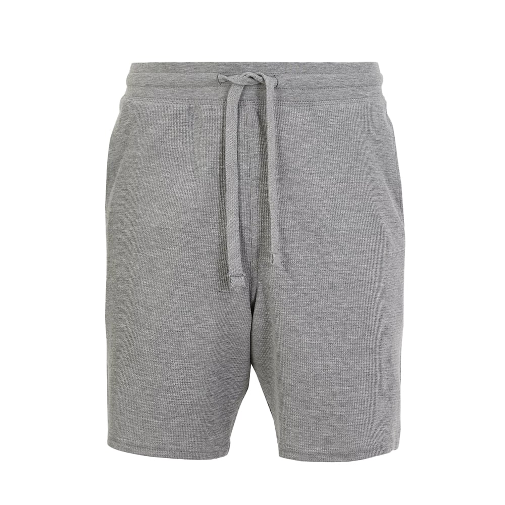 Knee-length ribbed gray knit lounge shorts.