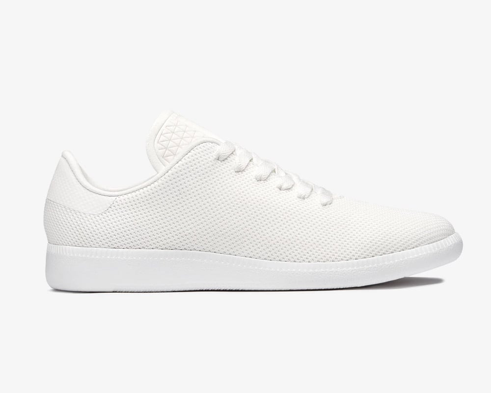 Minimalist men's white walking shoes.
