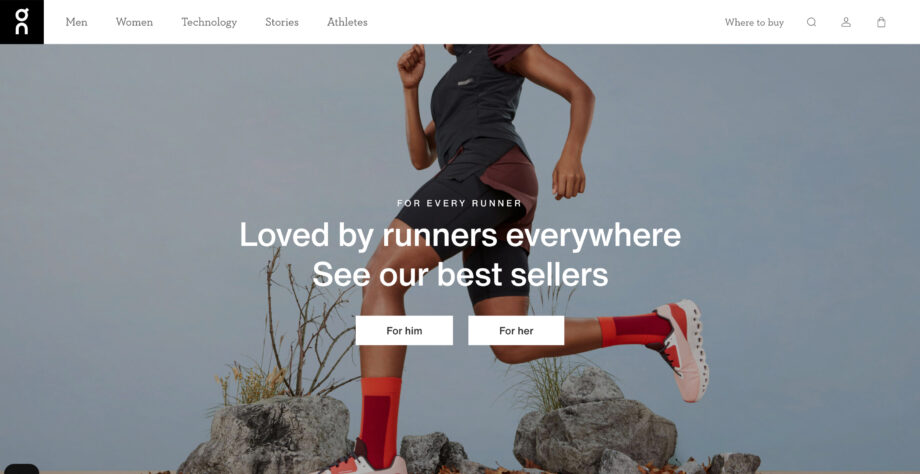 Runner in red outfit on rocky surface.