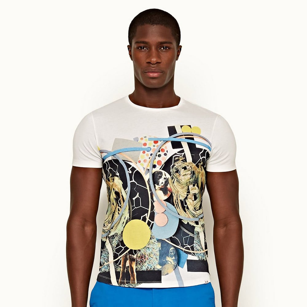 Person in abstract graphic t-shirt and stylish pants.