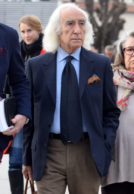 Elderly couple, third person teaching.