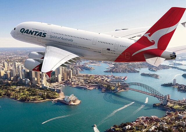 Qantas plane soars over Sydney's Opera House.