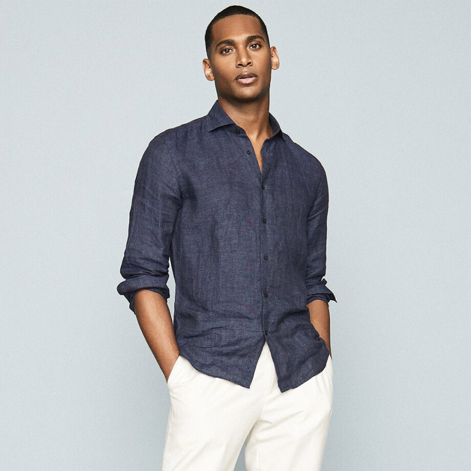 Person exudes effortless style in dark blue shirt.