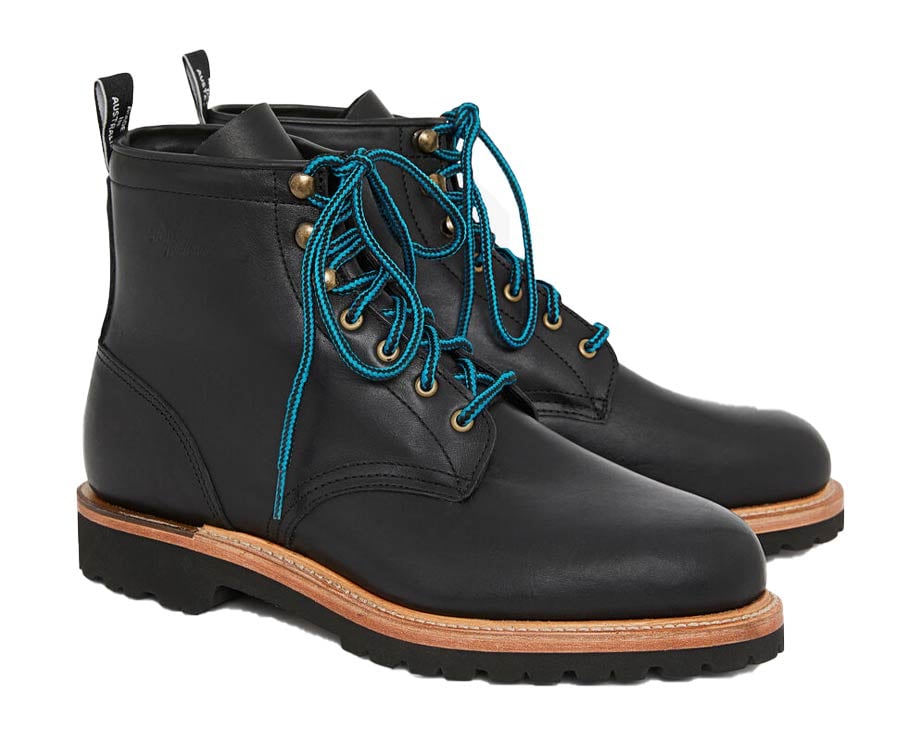 Black leather boots with blue laces, winter-ready.