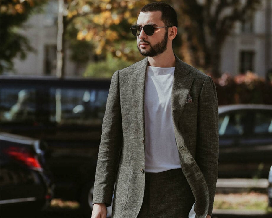 Man in gray suit exudes effortless style.
