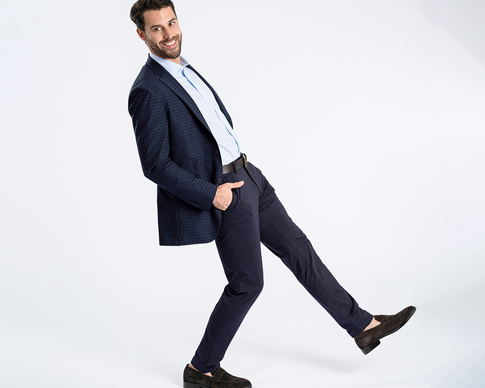 Man models men's fashion: blazer, shirt, loafers.