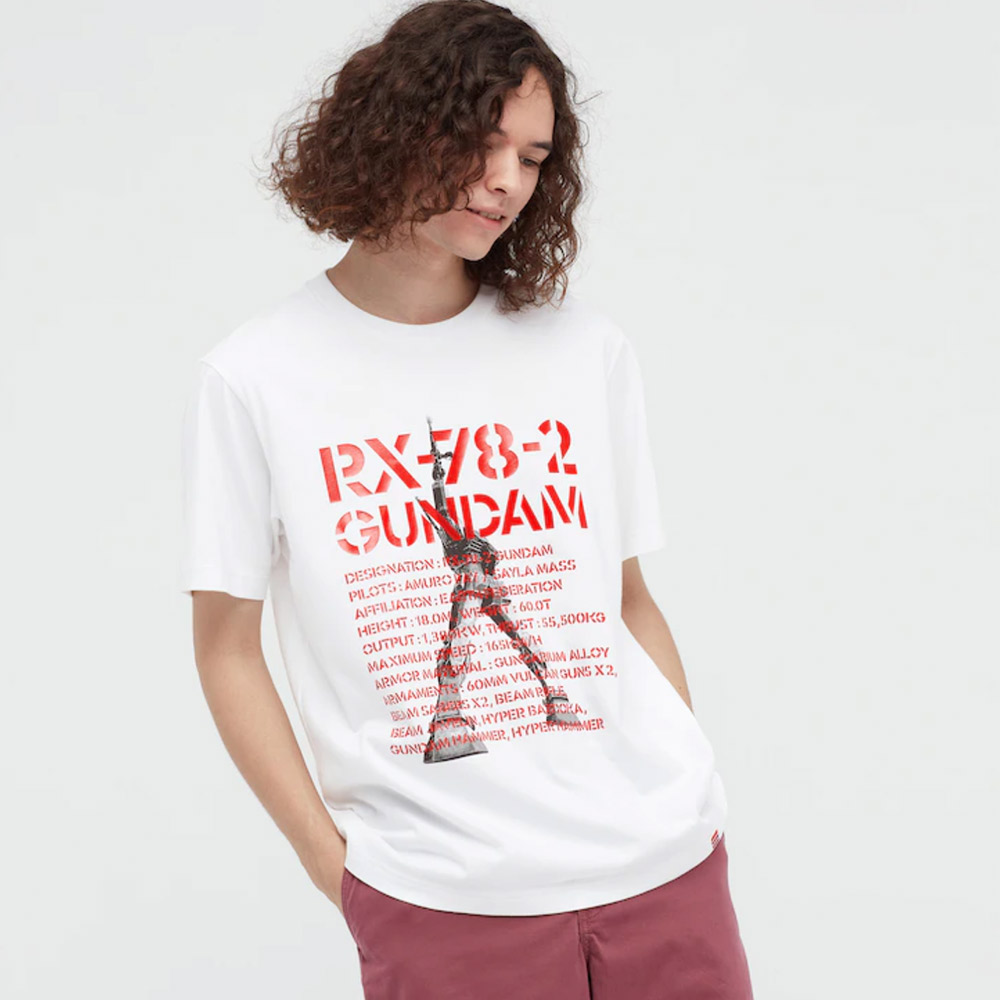 Curly-haired person rocks RX-78-2 Gundam T-shirt.