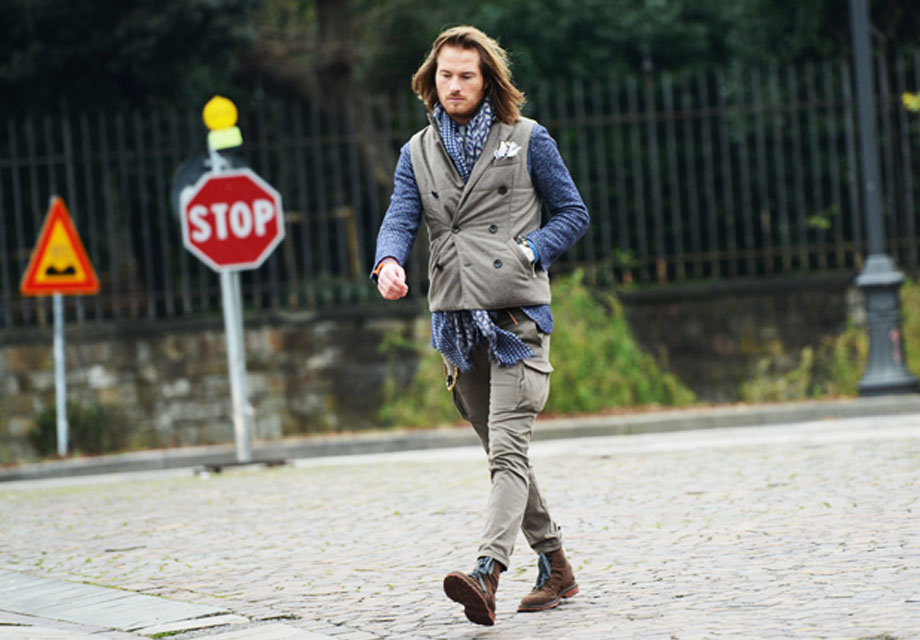 Confident man in layered outfit.