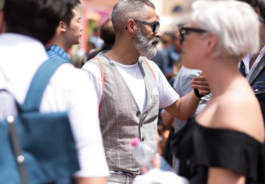 Mature man, blonde woman foreground.