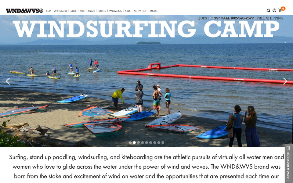 Windsurfing Camp: gear, surfers, lake.